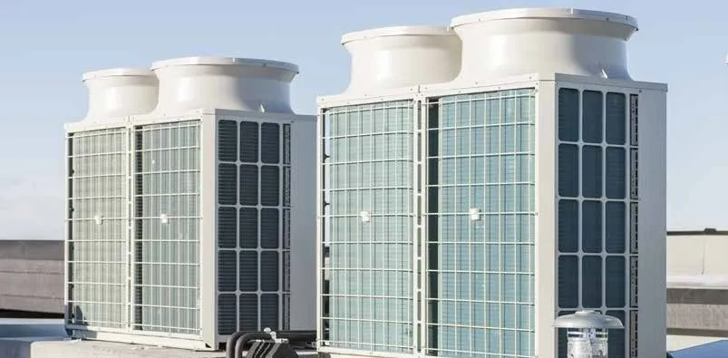 Two large commercial VRF rooftop condensing units installed on flat commercial roof